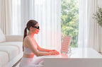 woman using nanoleaft red light therapy panel